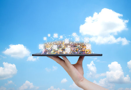 Communication concept human hand holding tablet city and communicationの写真素材