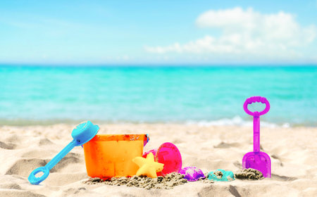 Children's beach toys on the sand and sea.の写真素材