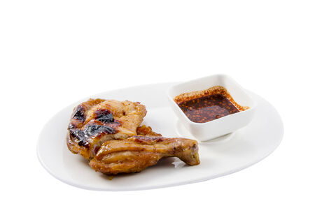Grilled chicken thailand on isolate white backgroundの写真素材