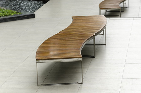 Modern woodern bench at parkの写真素材