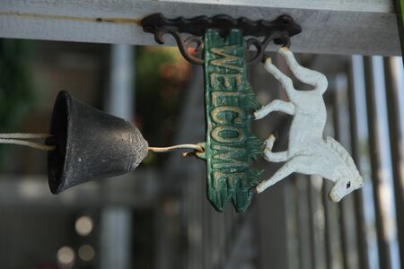 Welcome at home over old white wooden backgroundの写真素材
