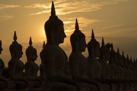 Big buddha statue in sunset background, Buddha statue in Thailand, art of religion conceptの写真素材