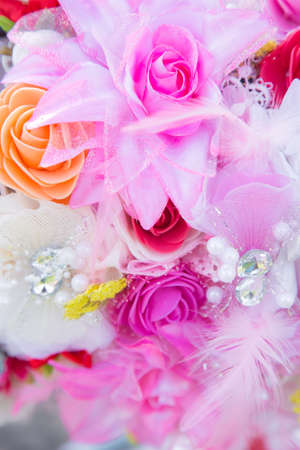 Floral background. Lot of artificial flowers in colorful composition,closeup flowers backgroundの写真素材