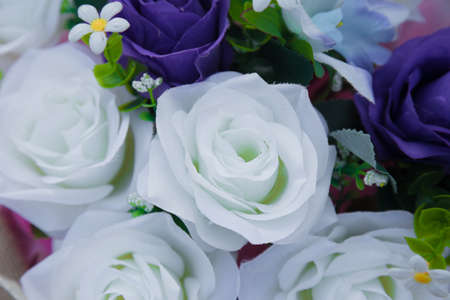 Floral background. Lot of artificial flowers in colorful composition,closeup flowers backgroundの写真素材