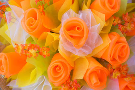 Floral background. Lot of artificial flowers in colorful composition,closeup flowers backgroundの写真素材