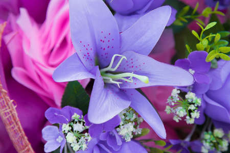 Floral background. Lot of artificial flowers in colorful composition,closeup flowers backgroundの写真素材