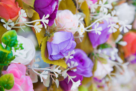 Floral background. Lot of artificial flowers in colorful composition,closeup flowers backgroundの写真素材