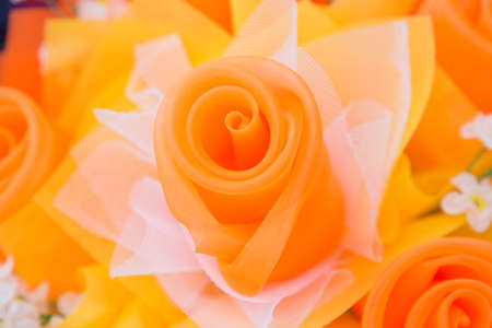 Floral background. Lot of artificial flowers in colorful composition,closeup flowers backgroundの写真素材