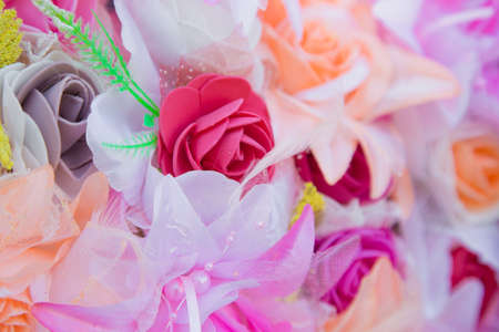 Floral background. Lot of artificial flowers in colorful composition,closeup flowers backgroundの写真素材