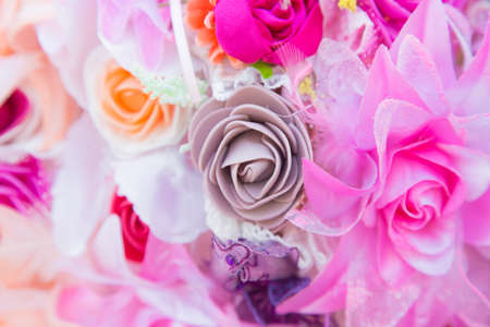 Floral background. Lot of artificial flowers in colorful composition,closeup flowers backgroundの写真素材