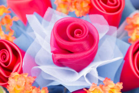 Floral background. Lot of artificial flowers in colorful composition,closeup flowers backgroundの写真素材
