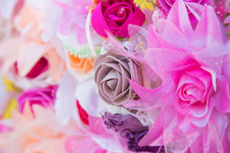 Floral background. Lot of artificial flowers in colorful composition,closeup flowers backgroundの写真素材