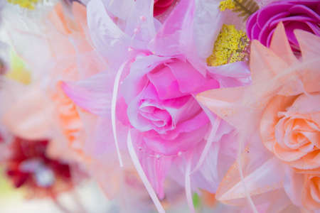 Floral background. Lot of artificial flowers in colorful composition,closeup flowers backgroundの写真素材