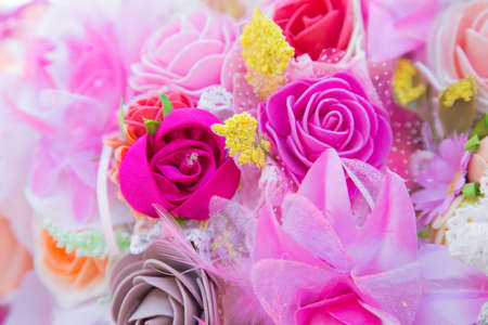 Floral background. Lot of artificial flowers in colorful composition,closeup flowers backgroundの写真素材