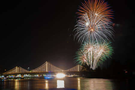 SURATTHANI, THAILAND - OCTOBER 17 : Beautiful firework display for celebration on the Tapee river on parades in Chak Phra Festival on October 17, 2015 in Suratthani, Thailand.の写真素材