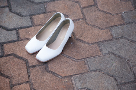 Child's sandals on a corridor backgroundの写真素材