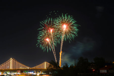 SURATTHANI, THAILAND - OCTOBER 17 : Beautiful firework display for celebration on the Tapee river on...