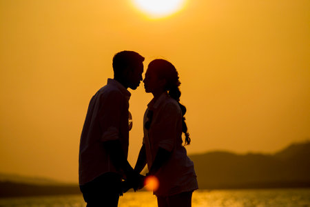 Silhouette young couple at sunset.Valentine's concept.の写真素材