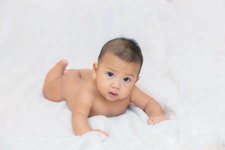 Cute kids in a good mood Sit down on the couch,Happy baby wearingの写真素材