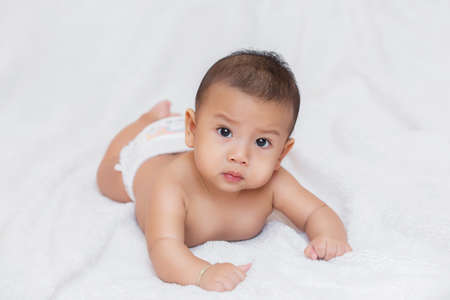 Cute kids in a good mood Sit down on the couch,Happy baby wearingの写真素材