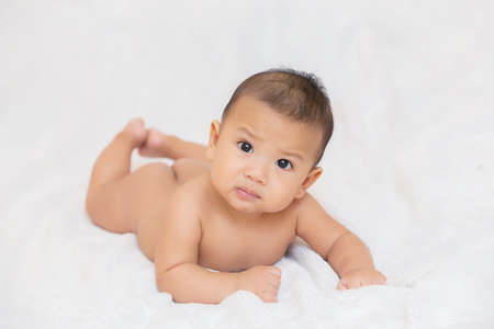 Cute kids in a good mood Sit down on the couch,Happy baby wearingの写真素材