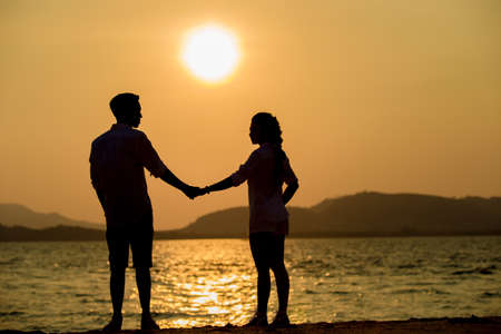 Silhouette young couple at sunset.Valentine's concept.の写真素材