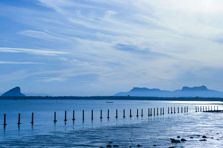 Clear blue sky, sEA and white clouds summer background, Clouds in blue sky over a calm Sea at thailand.の写真素材
