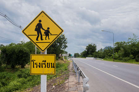 Warning sign, school sign for students school crossing the street.の写真素材