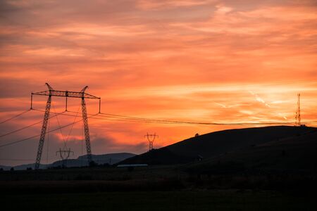 Electric pylon at sunsetの写真素材
