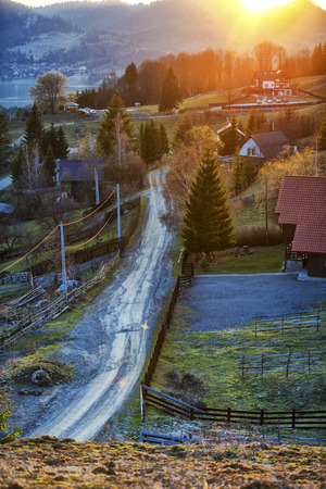 Rural road at the sunset in Colibita, Romaniaの写真素材