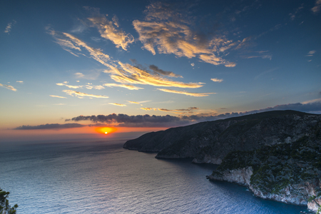 Clouds at the sunset in greeceの写真素材