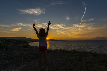 Silhouette girl at the seaの写真素材