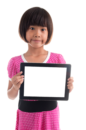 Little asian girl holding white board on white backgroundの写真素材