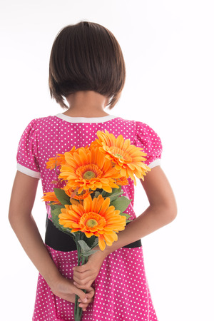 Little asian girl Flower Child Holding Flower on white backgroundの写真素材