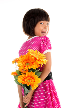 Little asian girl Flower Child Holding Flower on white backgroundの写真素材