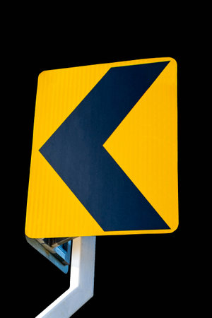 chevron traffic sign isolated on black background