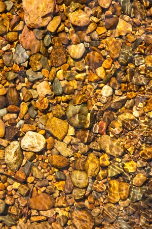 Stone in the river with a little waveの写真素材
