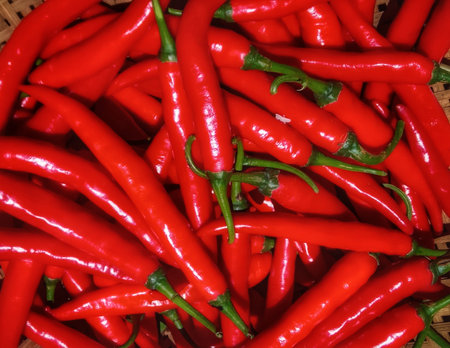 Red hot chili peppers in a basket. Close-up. Top view.