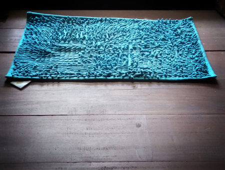 Blue towel on the wooden floor with copy space for your text.の写真素材