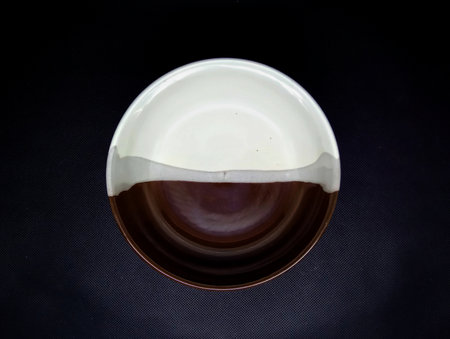 Japanese sake in a white cup on a black background, top viewの写真素材