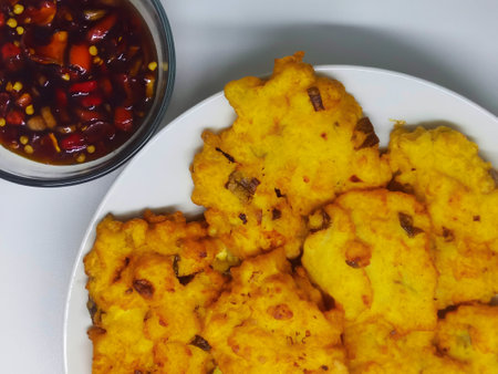 Crispy fried cauliflower cake with sweet and sour sauce.の写真素材