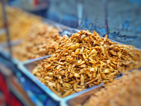 Fried chicken at the street food market in India. Selective focus.の写真素材