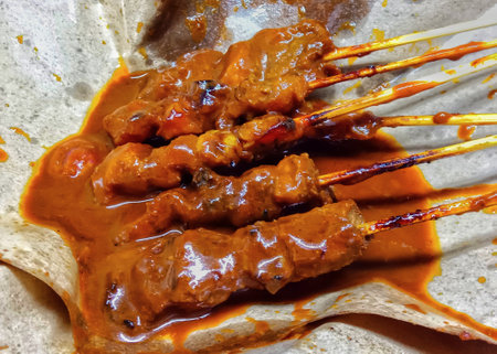 Grilled beef satay with sweet and sour sauce, close upの写真素材