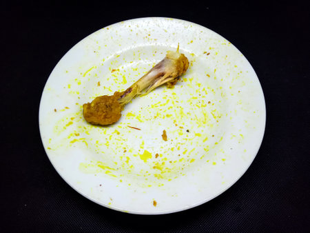 Fried fish on a white plate. Isolated on black backgroundの写真素材