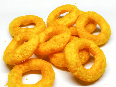 Pile of crunchy corn rings isolated on a white background.の写真素材