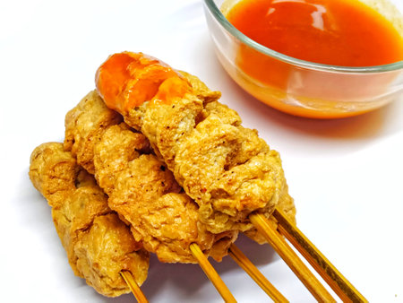 Vietnamese pork satay with sweet chili sauce on white backgroundの写真素材