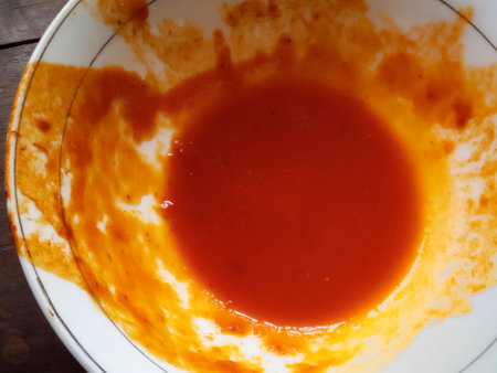 close up of a bowl of tomato sauce in a restaurant, top viewの写真素材
