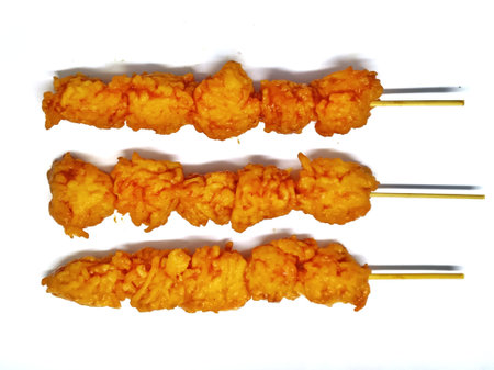 Fried shrimp on a stick isolated on white background, top viewの写真素材
