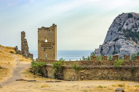 Walls of Genoese fortress in Sudak, Crimea. Scenic views of rocky cliffs near ancient Genoese...
