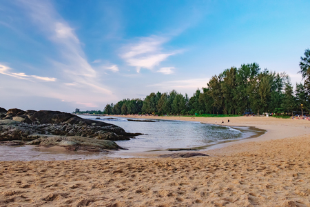 Beautiful seascape with sea and rock in Nang Thong Beach, Khao Lak, Thailand. View of calm sea with protruding stones and vacationers. Nature composition.の写真素材